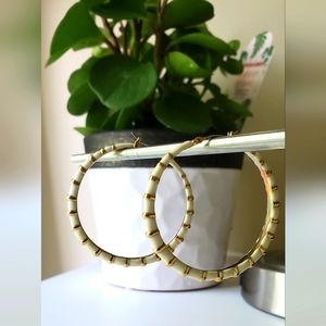 Gold tone white bamboo style hoop earrings